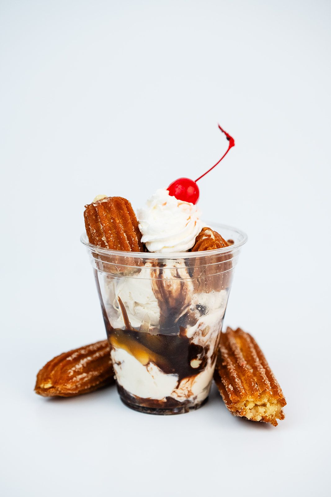A Las Delicias ice cream sundae served with churros