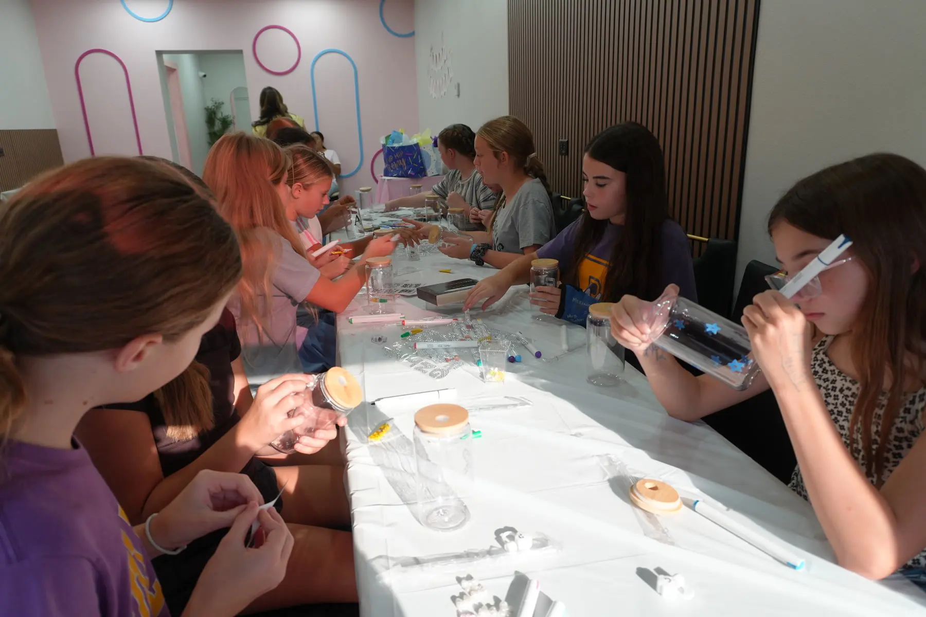 Guests gathered around a decorated table in the party room.