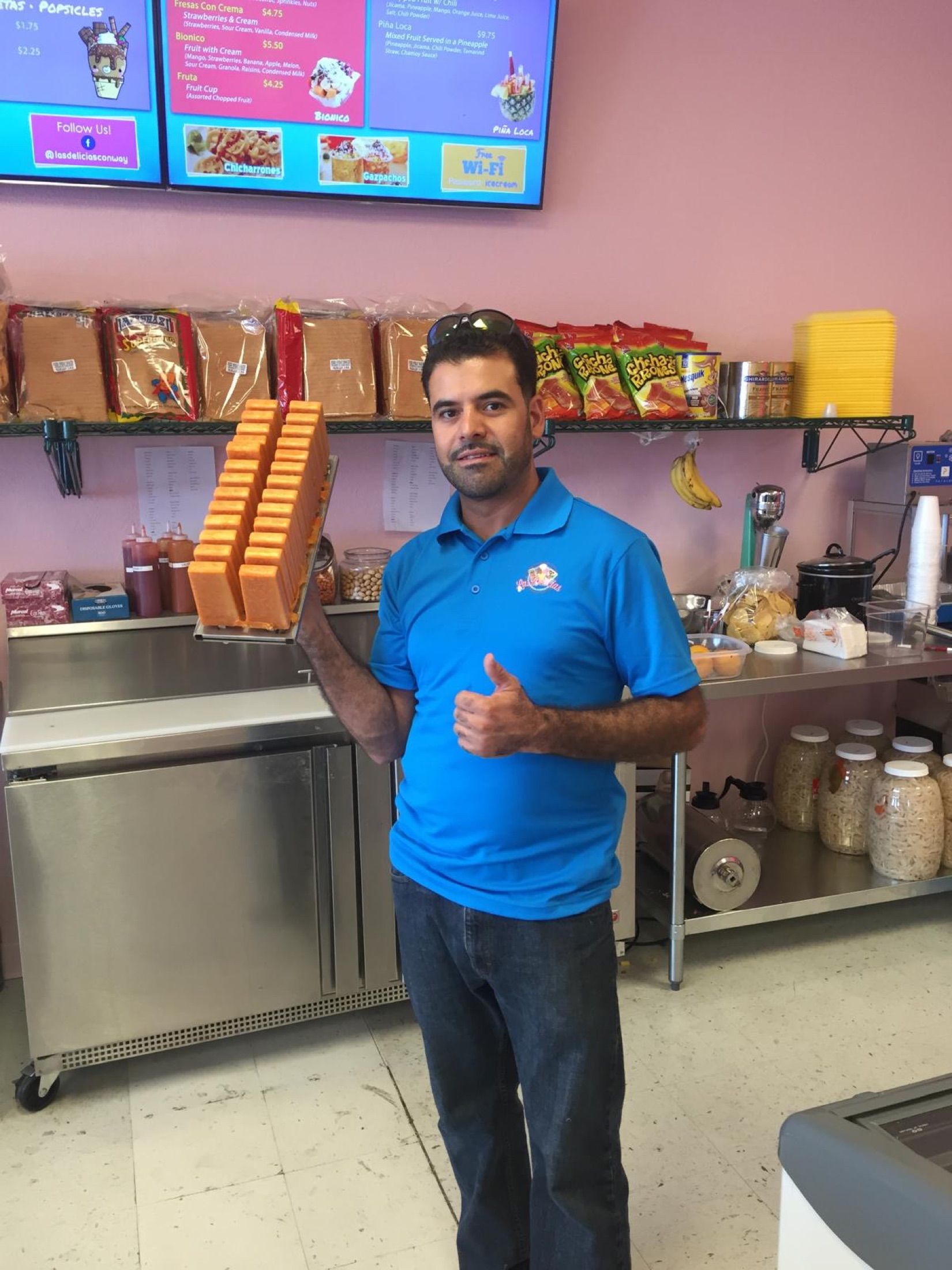 Samuel Ramirez holding a tray of freshly made paletas